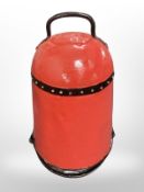 An enamel metal fire bucket