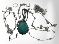 A group of silver/white metal jewellery to include garnet crucifix pendant on chain,