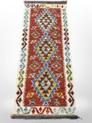 A Chobi Kilim runner, 150cm x 62cm.