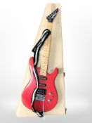 A Washburn G-Junior electric guitar.