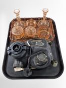 An Art Deco peach glass dressing table set, together with a military gas mask.