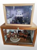 Two doll's house dioramas containing furniture and decorations,