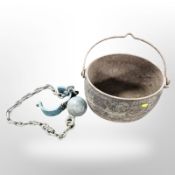 A 19th-century Clark and Company cast-iron swing-handled cooking pot, width 38cm,