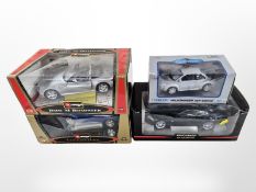 Four boxed die cast scale model cars including Burago,
