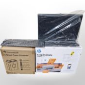 A boxed HP printer, Sony keyboard, laptop stand and a shredder.
