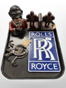 A cast iron money box, pair of Michelin Man bookends,