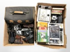 A group of vintage cameras including Kodak, Pentax, etc.