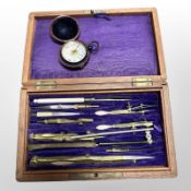 A mahogany-cased precision drawing instrument set, together with a damp detector in travel case.