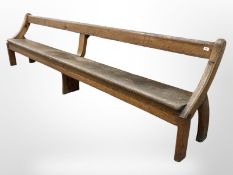 A pitch pine waiting room bench,
