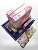 A group of toys and board games including Barbie, Moshi Monsters, Lol Surprise, etc.