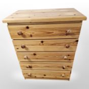 A contemporary pine four drawer chest,