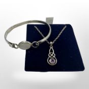 A silver and amethyst Celtic pendant on chain,
