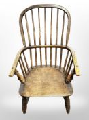 A 19th century elm spindle back Windsor style low armchair ,