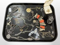 A group of costume jewellery, chain purse,