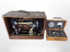A Singer hand sewing machine and a Spirit of St Louis radio alarm clock.