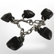 A Friedrich Binder Monisheim 7-inch modernist silver bracelet with carved wooden ethnic charms,