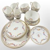 Twenty-three pieces of Minton tea and dinner porcelain decorated with floral garlands,