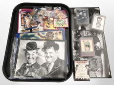 A quantity of Laurel and Hardy collector's cards, lapel badge, etc.