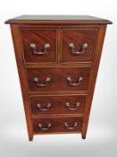 A reproduction mahogany five drawer slim chest,
