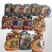 12 Hasbro and Bandai figurines including Iron Man 2, Indiana Jones, and Thundercats, boxed.