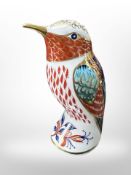 A Royal Crown Derby porcelain hummingbird paperweight with gold stopper, height 10cm.