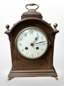 A late-Victorian mahogany and satinwood-inlaid eight day bracket clock striking on a gong with