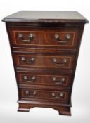 A reproduction mahogany four drawer chest,