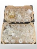 A collection of crystal drinking glasses, oil lamp with silver plated base,