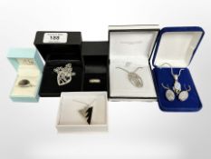 A group of silver jewellery comprising an Art Nouveau-style pendant, mother of pearl ring,