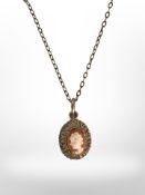 A vintage 9ct yellow gold cameo pendant on gold fine link chain.