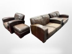 A four piece brown leather lounge suite comprising a pair of two seater settees,