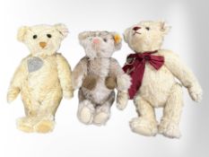 A Steiff Merry Christmas teddy bear, together with Grandma Knitting teddy bear, and one other.