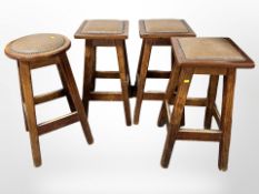 Three stained pine leather topped bar stools and a further similar stool