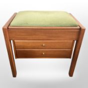 A contemporary storage piano stool,