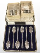 A cased set of six silver teaspoons, Sheffield marks, and two further napkin rings.