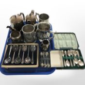 A group of silver-plated tea wares and tankards, cased cutlery.