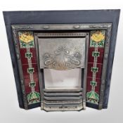 An Art Nouveau tiled cast iron fire surround,