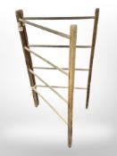 An Edwardian pine folding clothes rail
