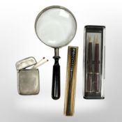 A silver match vesta,