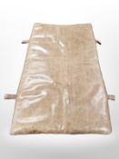 A vintage stitched tan leather gymnasium mat,