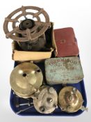 A group of vintage metal camping stoves and components, tin boxes, etc.