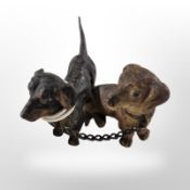 A figural group of two cold-painted metal Dachshunds, length 7.5cm.