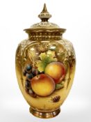 A Royal Worcester pot pourri with cover, hand-painted with panels of fruit by D Fuller,