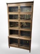A Minty Ltd, Library Specialists, Oxford, glazed oak five height stacking bookcase,
