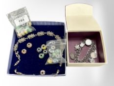A quantity of silver charms, costume charm bracelet, and a silver and marcasite necklace.
