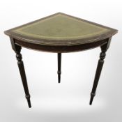 A reproduction corner table with tooled leather inset top,