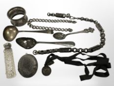 A small group of silver items including spoons, antique chain, antique locket,