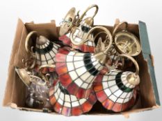 A group of Tiffany-style leaded glass wall lights.