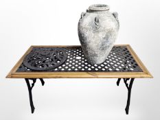 A pine and cast iron rectangular table length 117 cm,