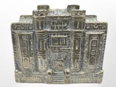 A brass 'County Bank' money box,